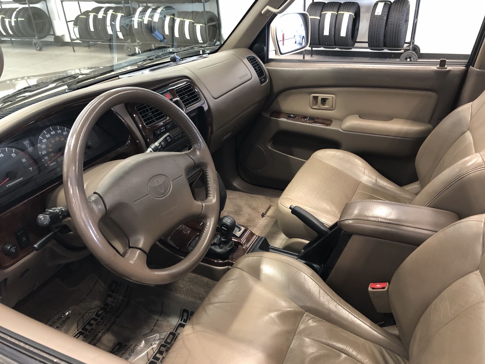 Tan leather interior with woodgrain dash